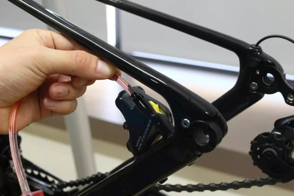 Use a flat-head screwdriver to remove the fixing bolts