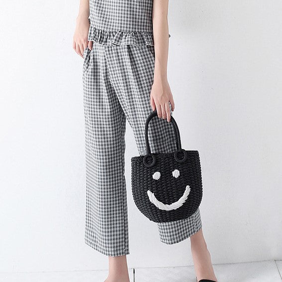 himoda straw bucket bag with smiling face