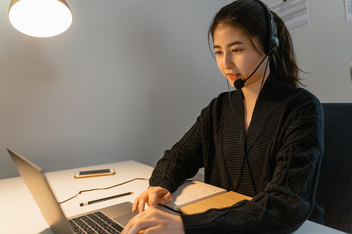 Deep work concentrated on women wearing headsets.