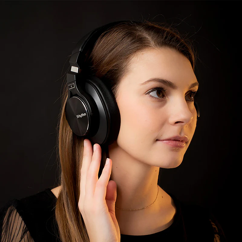 Woman listening to music using ANC Headphones