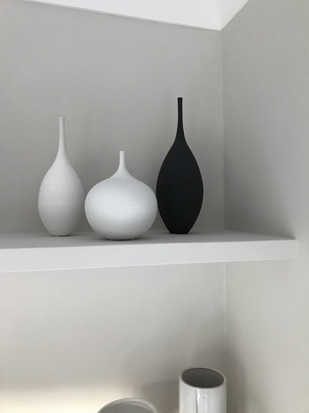 White vase on the shelf