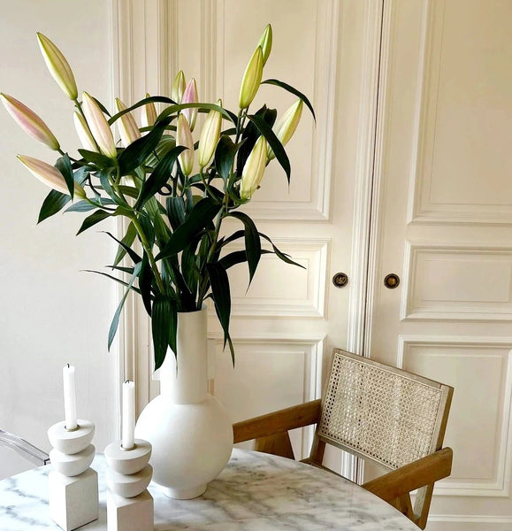 White vase on the dining table