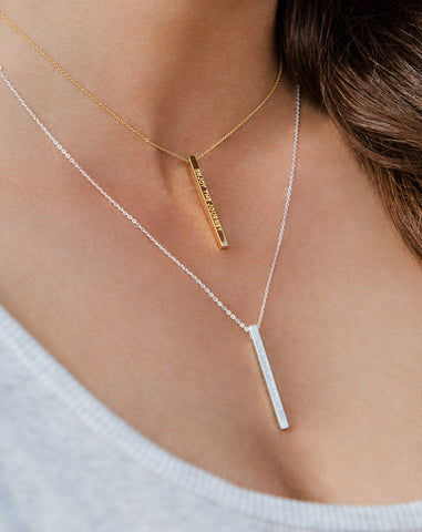 2 vertical 3d bar with engraving on woman's necklace