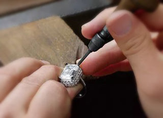 Adjust the diamond claws on the ring with an awl