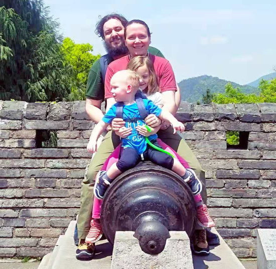 Family on cannon at Linhai Great Wall in Taizhou