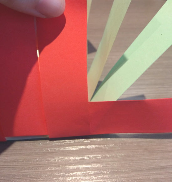 First side weaving strip taped behind corner strip