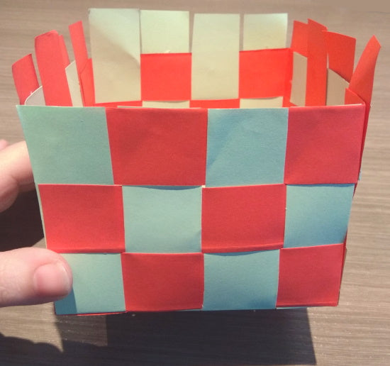 Trimming the excess paper at the top edge