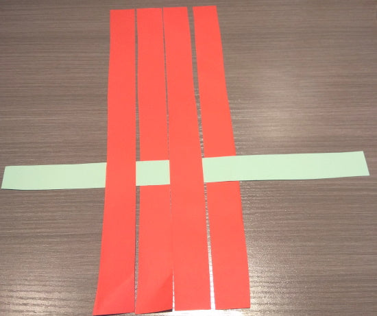 Weaving the first basket bottom strip