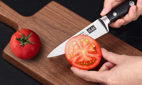 cortar un tomate con cuchillo clásico para frutas shan zu