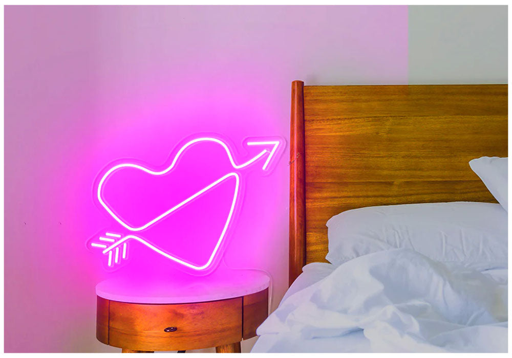 A arrow through heart neon lights