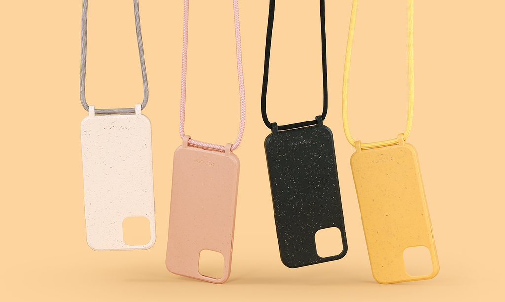 Four iphone 12 pro max cases hanging on a rope