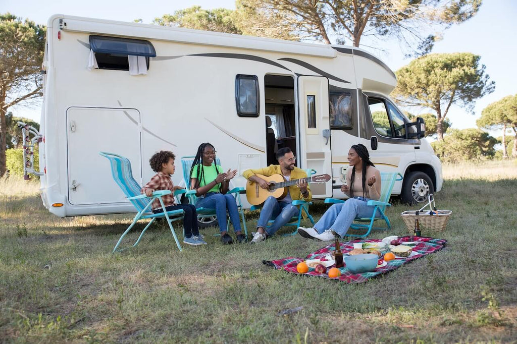 Group of people having a picnic in front of the RV