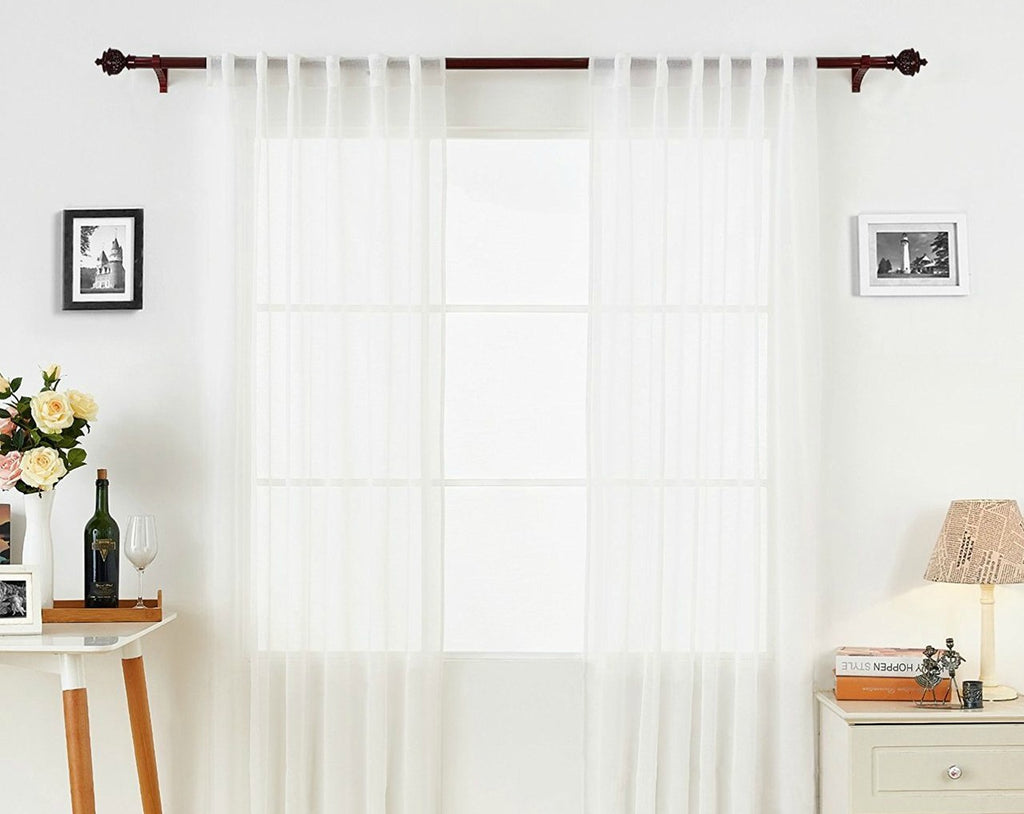 white voile curtains by art on white wall