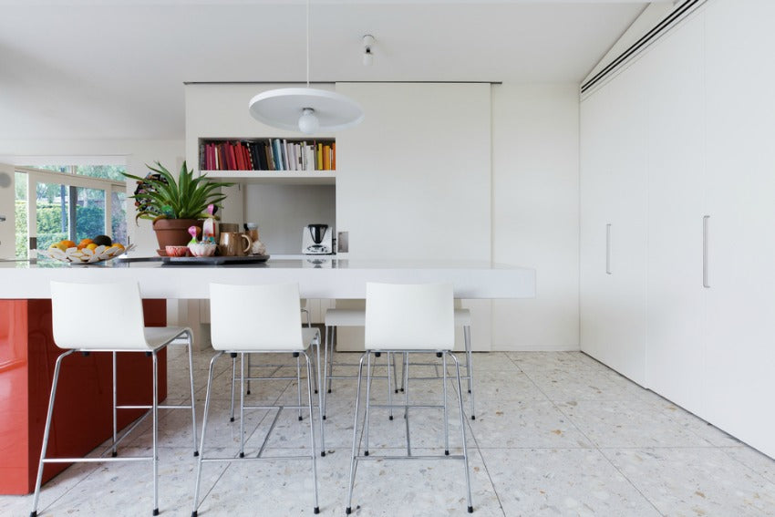 floors & ceiling of a white kitchen table surrounded by chairs