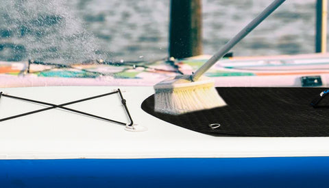 Real photo which washing and cleaning the paddle board