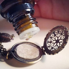 Dropping oil onto an essential oil diffuser pendant