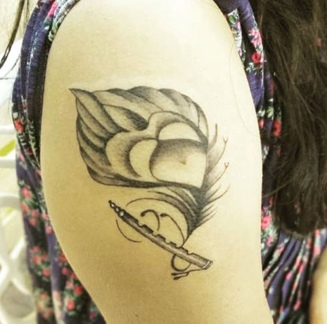 feather arm tattoo