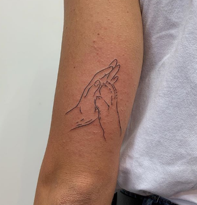 dog tattoo high five with dog
