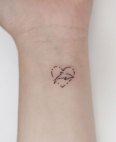heart frame dolphin tattoo