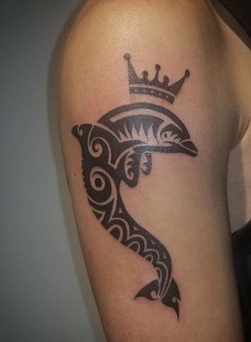 tribal dolphin tattoo with a crown