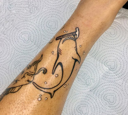 tattoo of shark with a hammer