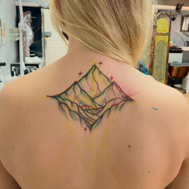 colorful line mountain tattoo on the back