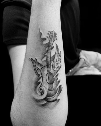 tattoo of Flying Guitar With Wings
