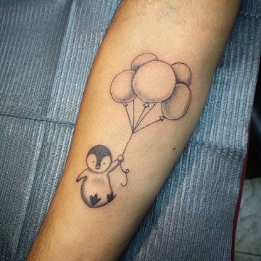 penguin with balloon tattoo