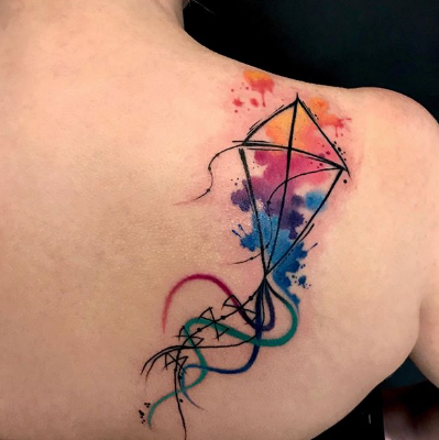 watercolor diamond kite tattoo on the shoulder