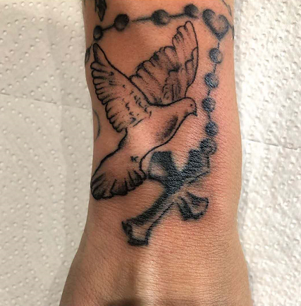 dove and rosary tattoo