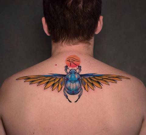 scarab tattoo on the upper back