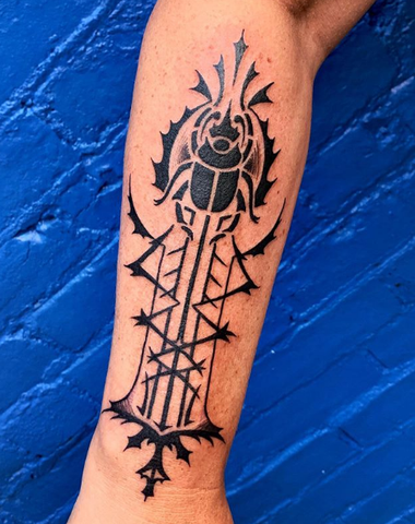 scarab tattoo on the forearm