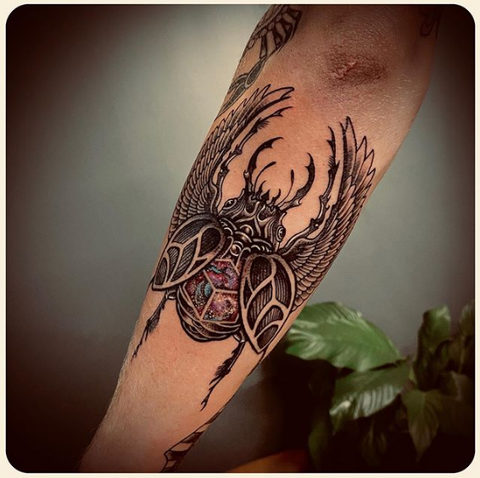 scarab tattoo design on the forearm