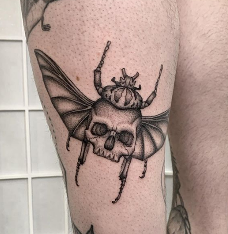skull and scarab tattoo