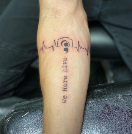 camera tattoo design on the forearm