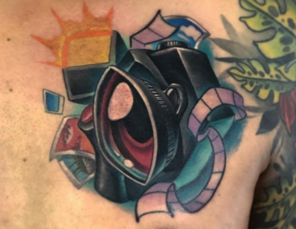 camera tattoo design on the chest