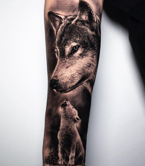 wolf and pup sleeve tattoo on arm