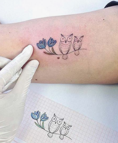 cute owl tattoo on forearm