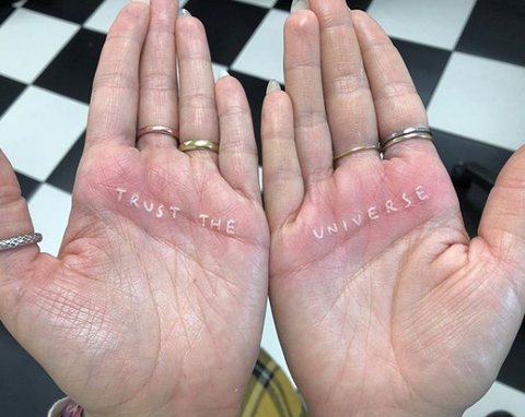 trust the universe hand lyric tattoo