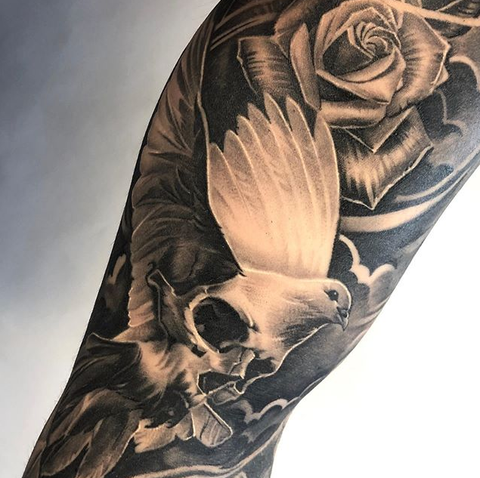 An amazing tattoo of a dove and rose inked in dotwork style Style  Dotwork Color Gray Tags Amazing B  Rose tattoos for men Cool chest  tattoos Dove tattoos