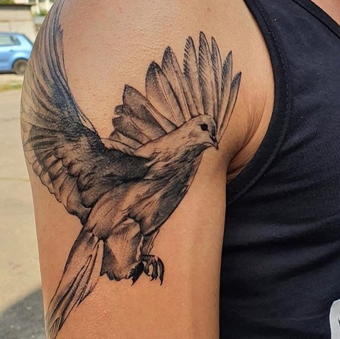 flying dove arm tattoo