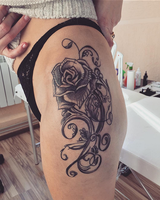 flower thigh tattoo