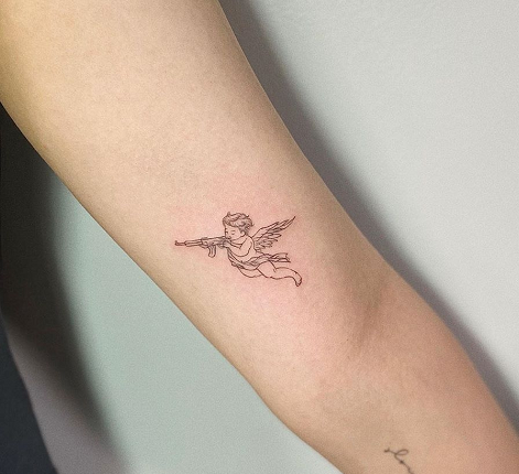 tiny angel arm tattoo