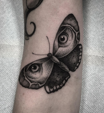 butterfly and eye tattoo