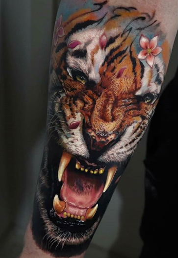 realistic tiger sleeve tattoo on arm