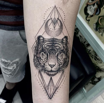 linear tiger tattoo on forearm