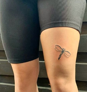 dragonfly thigh tattoo