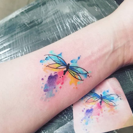 watercolor dragonfly forearm tattoo