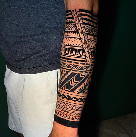 tribal tattoo on arm for men and women