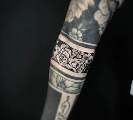 blackout flower sleeve tattoo for men and women